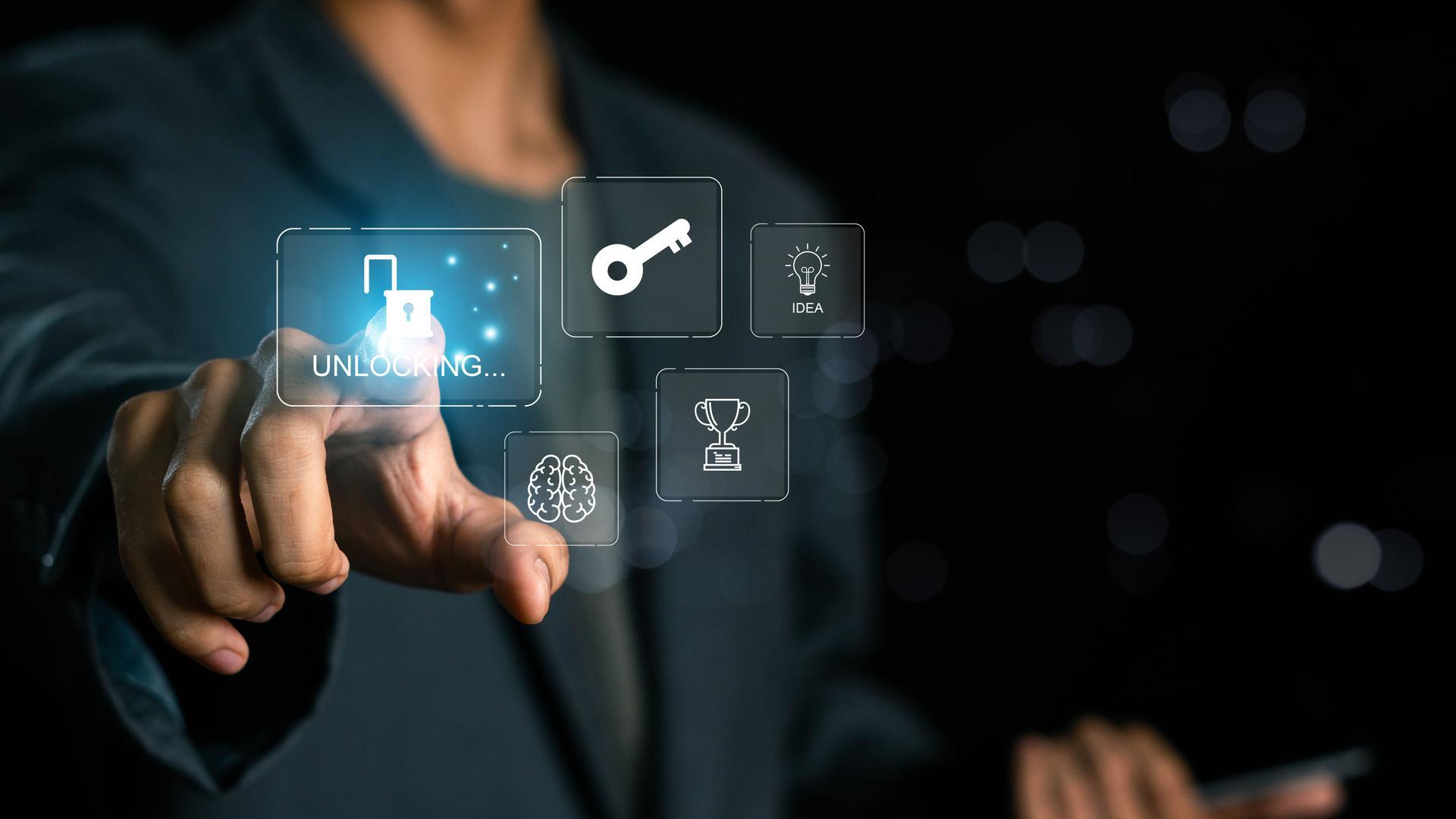 Businessman unlock success idea, creativity concept, Hand holding unlock virtual icon graphic Business innovation and technology concept. Key of Success business concept.