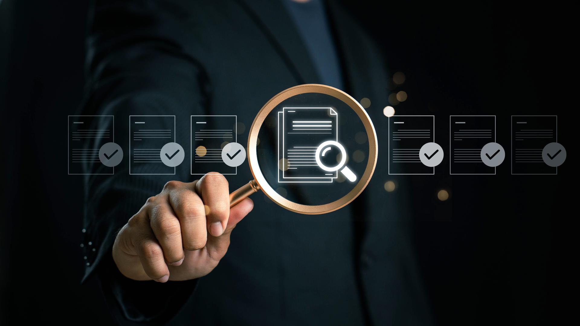 Consultant using magnifying glass to analyze unchecked proposal document in digital compliance review
